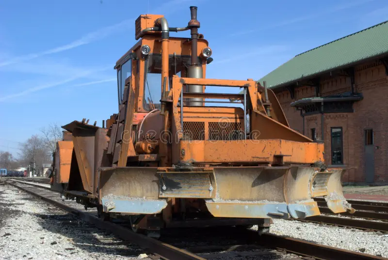 A snowplow used to clear railroad tracks. Railroad snowplow stock images, royalty-free photos and pictures