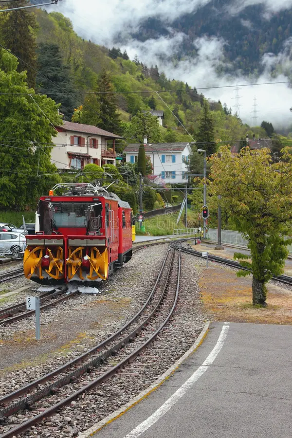 Gear railroad and snowplow of railway tracks. Glion, Montreux, Switzerland; 07-05-2017. Railroad snowplow stock images, royalty-free photos and pictures