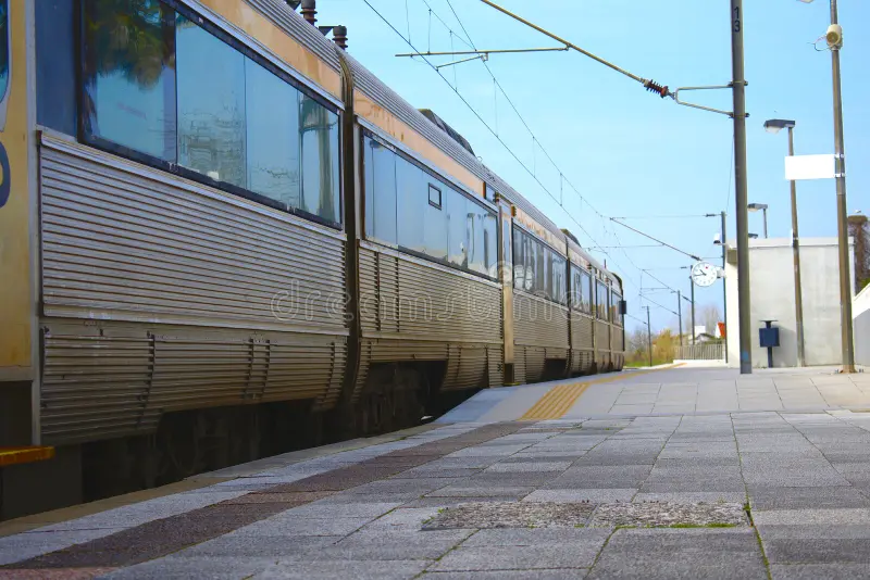 Side view of a train leaving a train station with no one in sight. Side subway train view stock images, royalty-free photos and pictures
