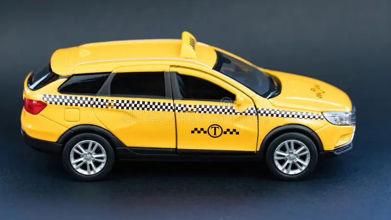 Yellow taxi cab side view on black background macro photography. Taxi service advertising banner. Car rental concept. Getting around the city by taxi. Taxi cab side view stock images, royalty-free photos and pictures