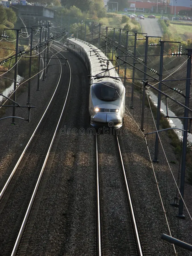 French TGV full speed on bright day stock images