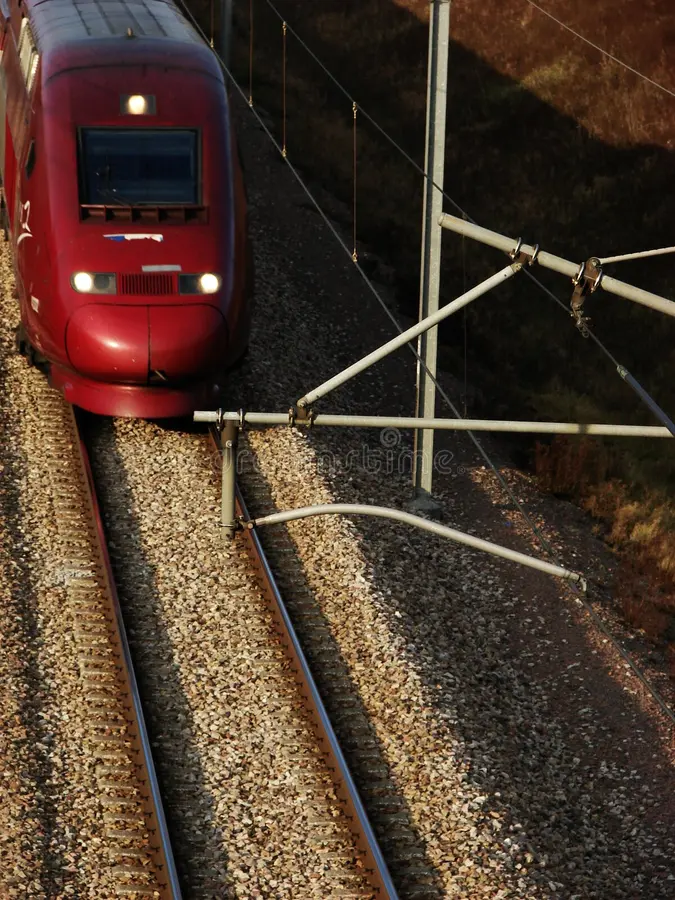 Fast french tgv Train on closeview. French tgv train on a close view on a side sunset light.
