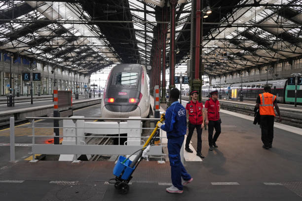 High-speed train beside an empty platform during service disruptions at Gare de Lyon railway station in Paris, France, on Friday, July 26, 2024....