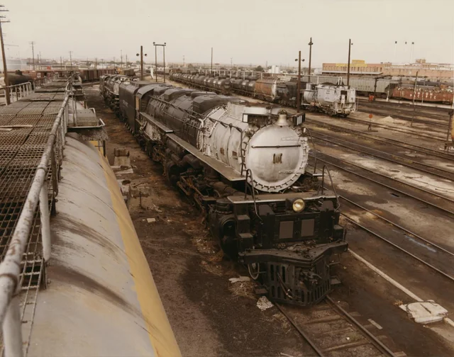 r/trains - Two Union Pacific Big Boy's await there fate in the Cheyenne deadline circa 1971. At this point they had been dormant for more than 10 years. ( Photo Credit: Dean Gray)