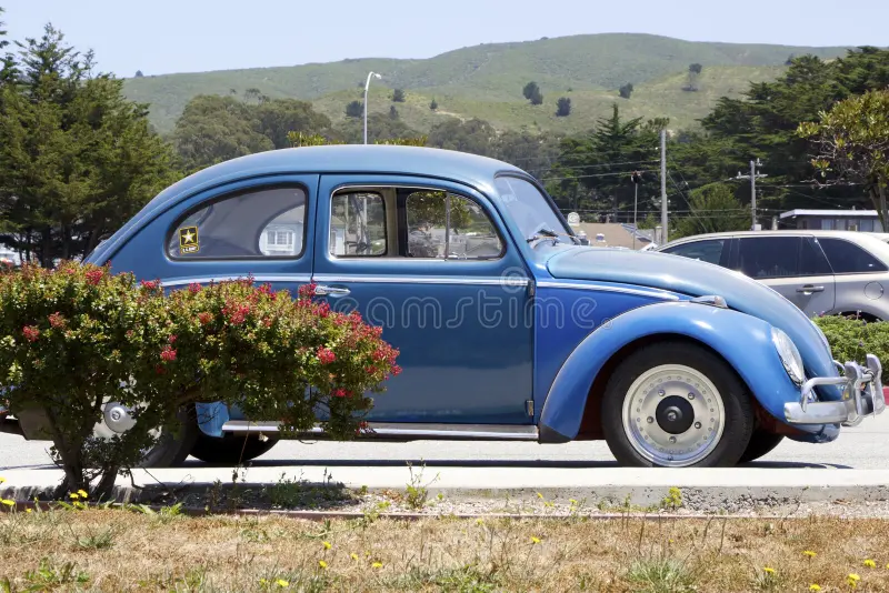 Half Moon Bay, California, USA - July 9, 2017: Blue Volkswagen Beetle parked on a city street side view. Blue German retro car. Old VW Beetle. Vw beetle side view stock images, royalty-free photos and pictures