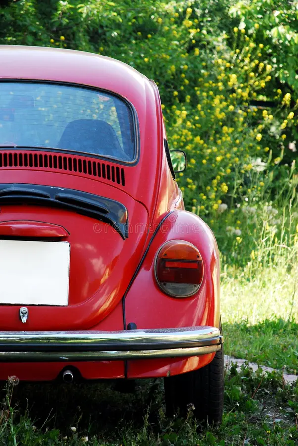 Beautiful view of old red VW Volkswagen Beetle. Vw beetle side view stock images, royalty-free photos and pictures